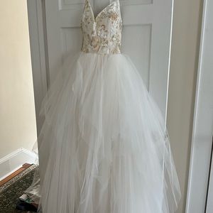 A Hayley Paige Wedding Gown that has never been worn